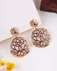 Lotus flower earrings with gold and purple details on a white background