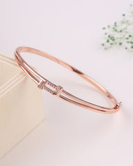 Rose gold bracelet on a light background