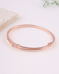 Rose gold bracelet on a light background