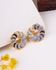 Pair of gold hoop earrings with blue and white circular patterns on a light background.