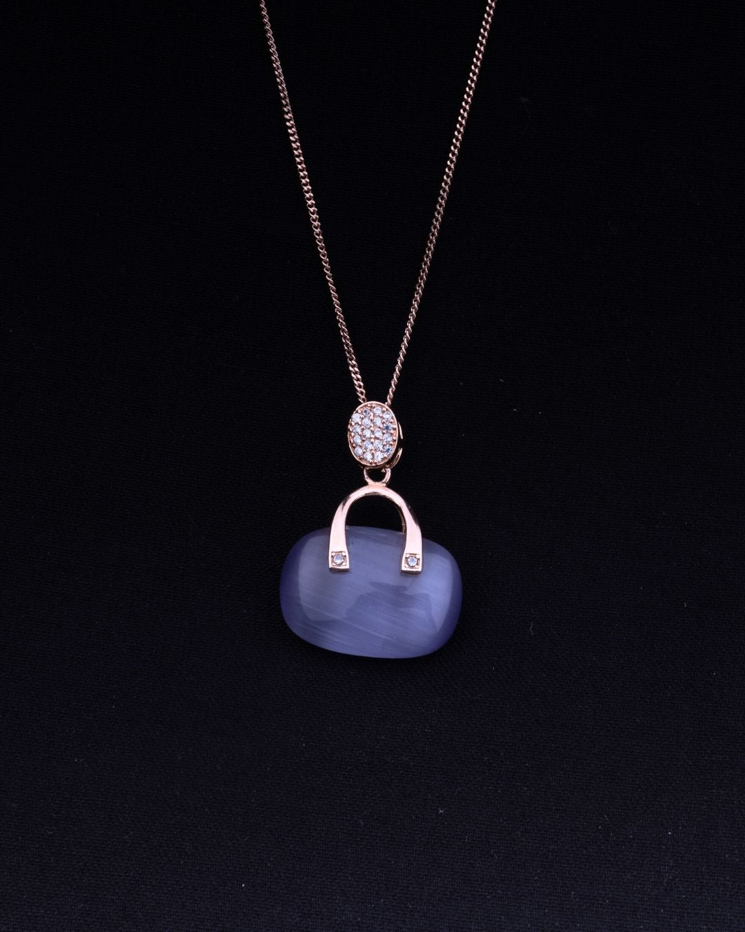 925 Sterling silver Necklace with a blue pendant and rose gold chain on a black background