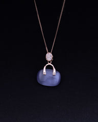 925 Sterling silver Necklace with a blue pendant and rose gold chain on a black background