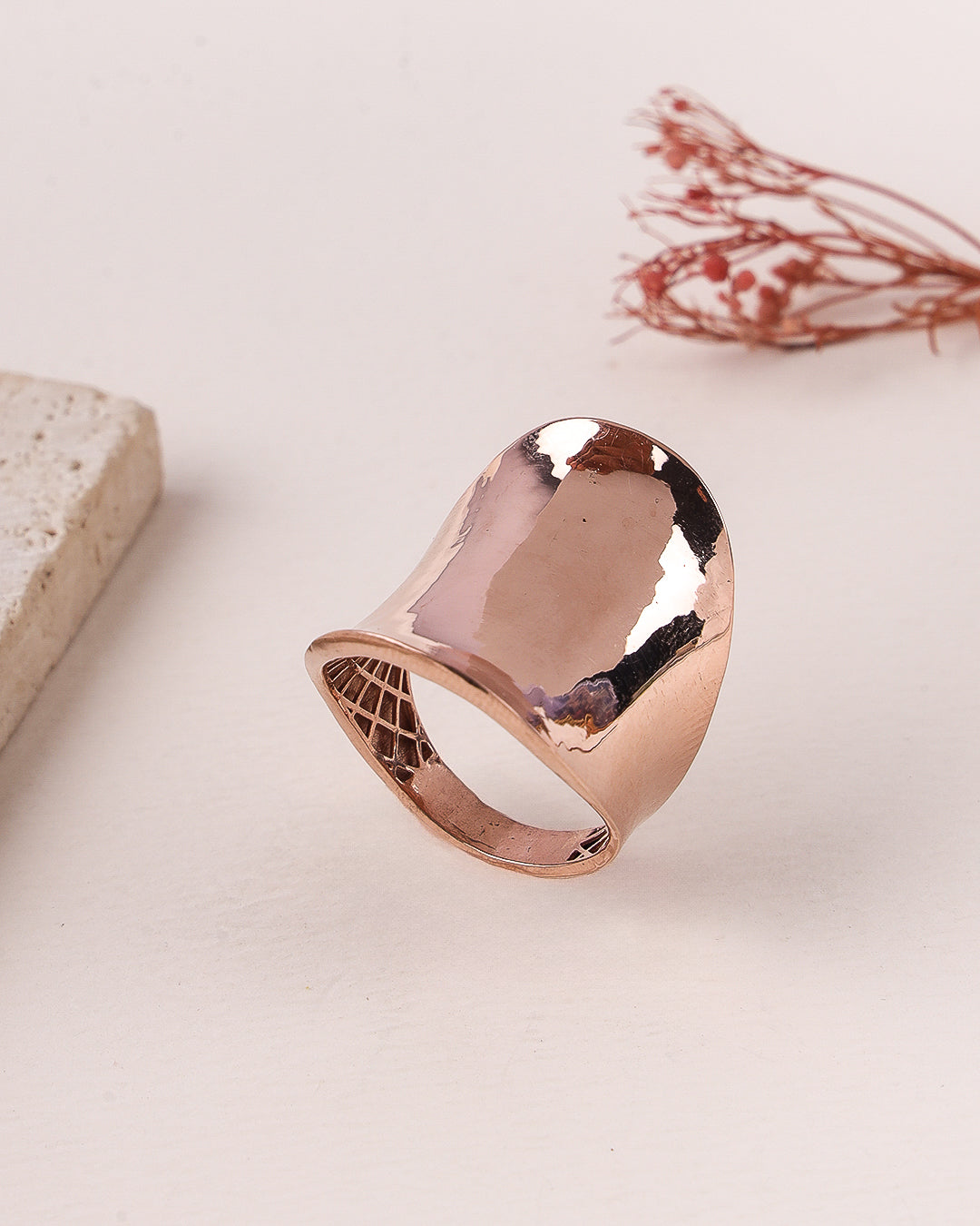 Rose gold ring on a light background