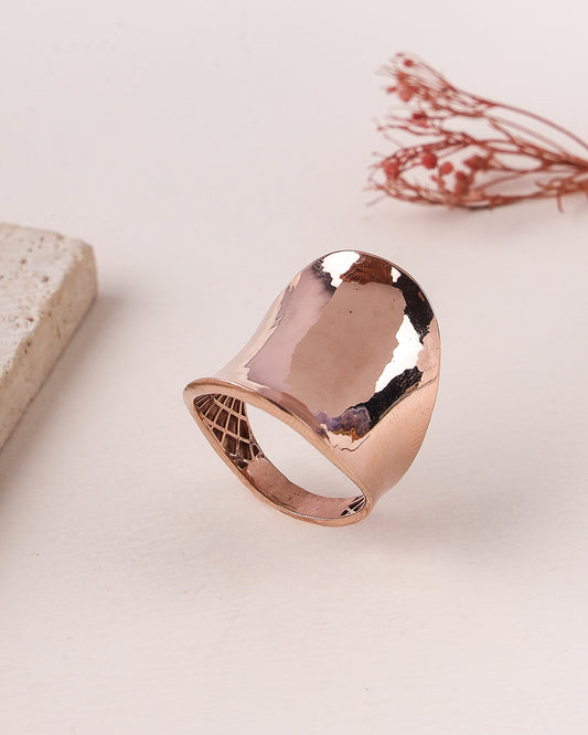 Rose gold ring on a light background