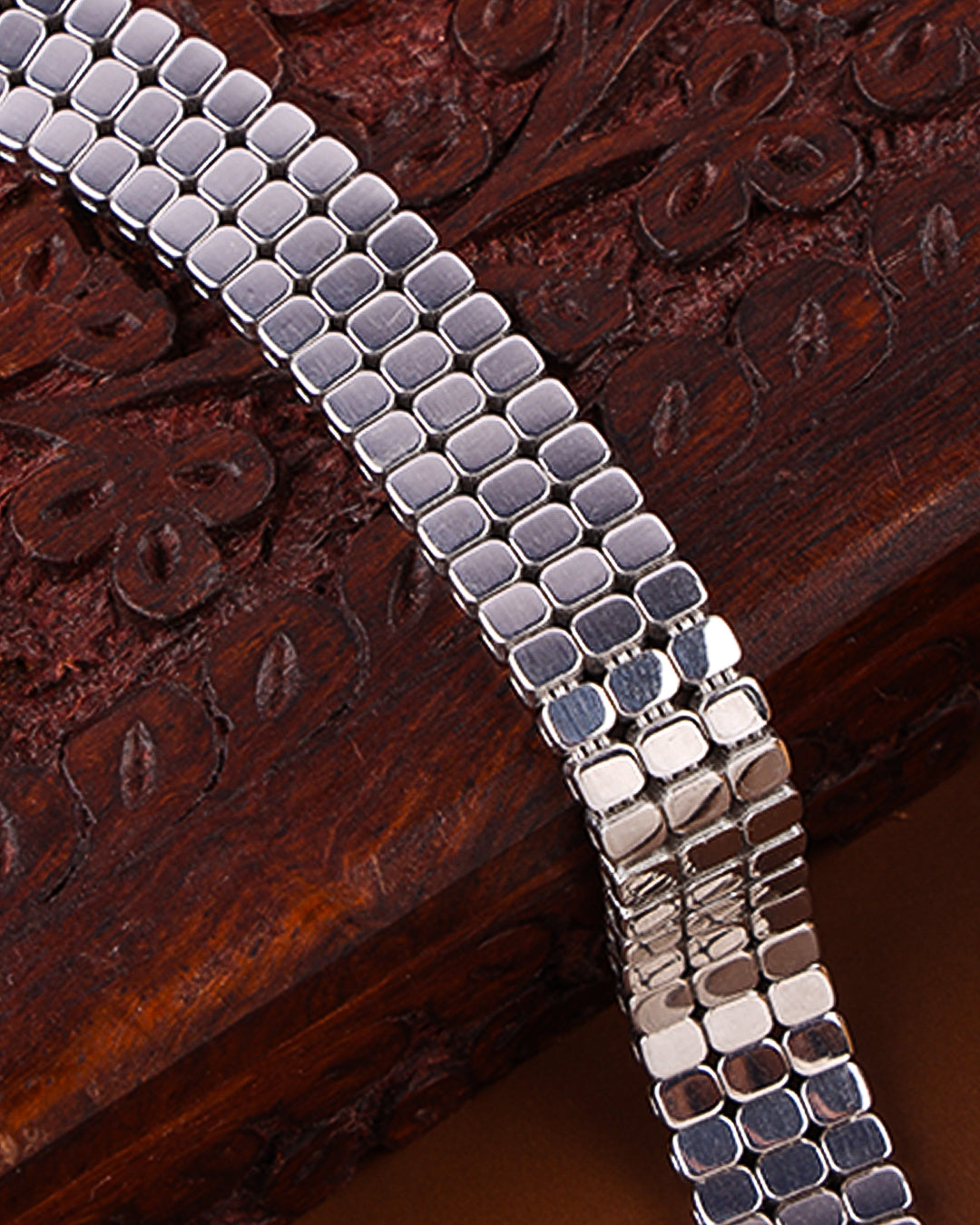 Silver bracelet on a wooden surface