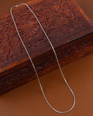 Silver chain on a wooden surface