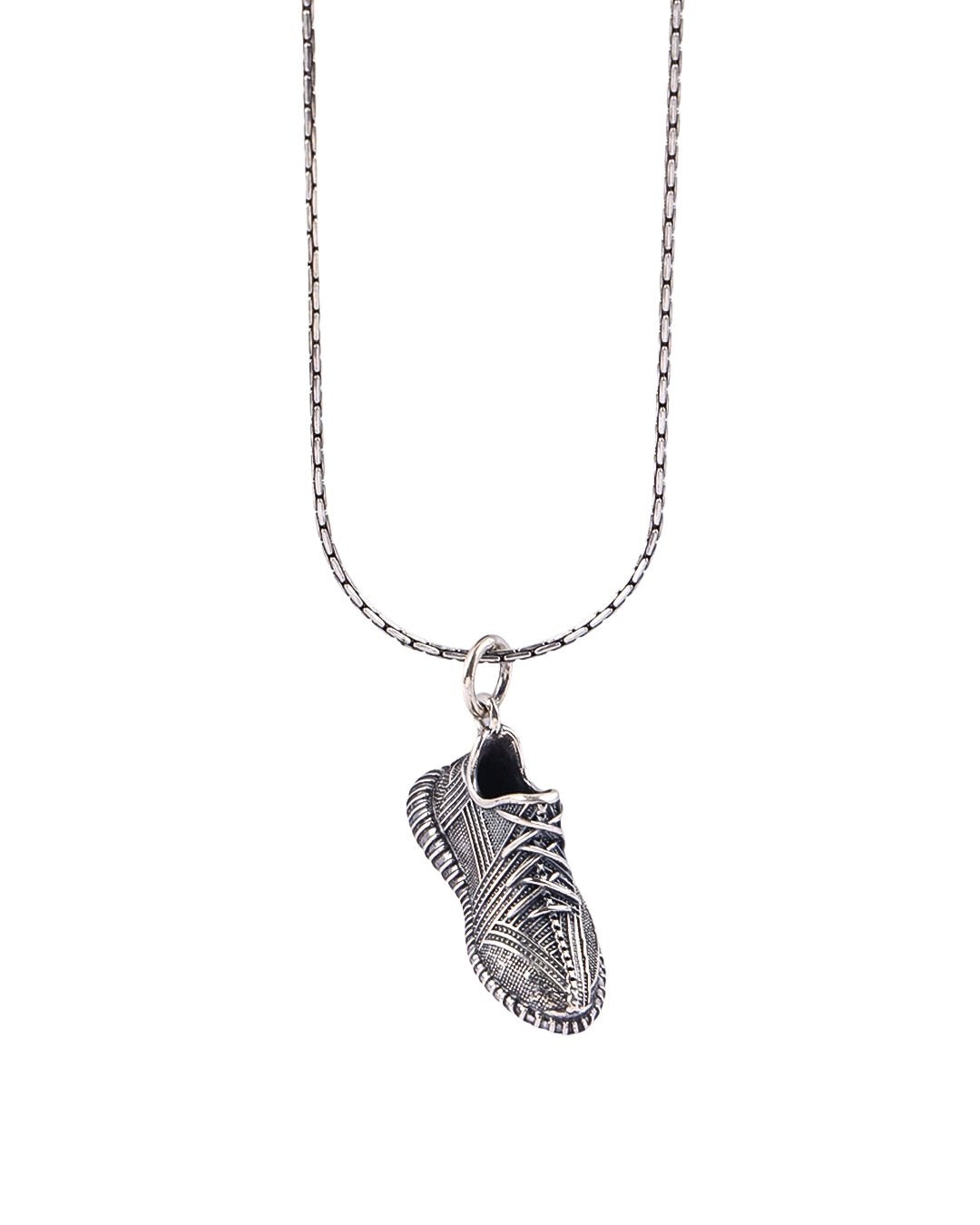 Silver necklace with a detailed pendant on a white background