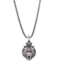 Silver necklace with a tiger head pendant on a white background