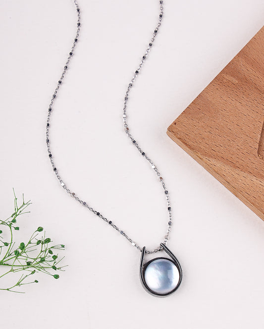 Necklace with a blue pendant on a white background