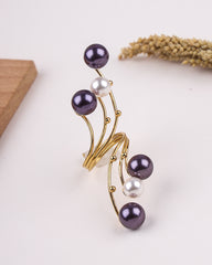 Pearl ring with gold wire on a white background