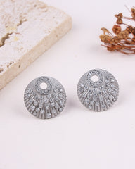 Silver earrings with gemstones on a light background