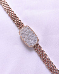 Rose gold bracelet with a diamond-encrusted clasp on a white background