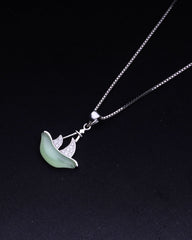 925 Sterling silver Necklace with a green leaf pendant on a black background