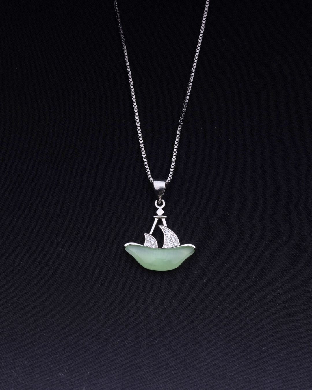 925 Sterling silver Necklace with a pendant shaped like a boat on a black background
