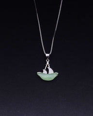 925 Sterling silver Necklace with a pendant shaped like a boat on a black background