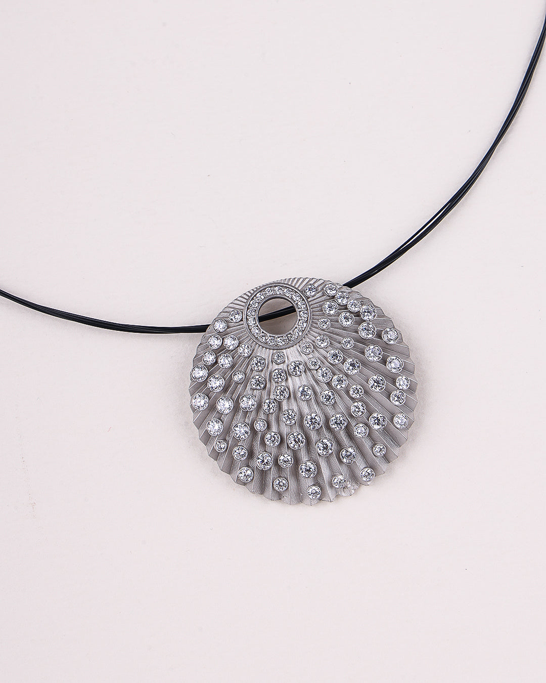 Silver pendant necklace on a white background