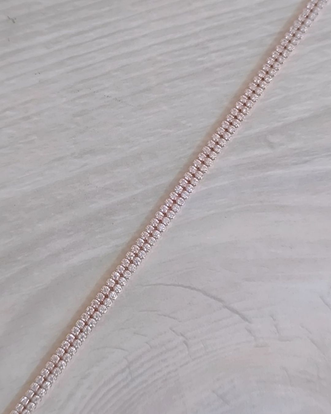 Close-up of Sterling Silver Bracelet on a textured white background