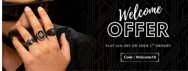 Hand wearing multiple rings with a promotional banner for a welcome offer on a black background
