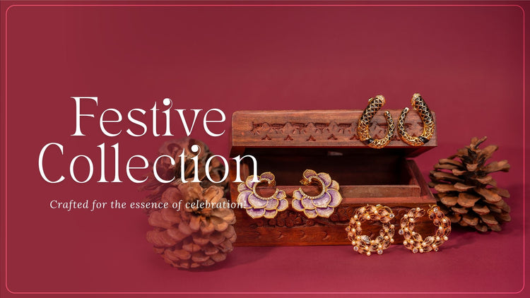 Decorative jewelry set with pinecones on a red background, featuring the text 'Festive Collection'.